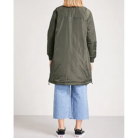 Back view of the CHOCOOLATE Reversible Two-Tone Shell Coat, showcasing the clean, minimalist design of the green side. Features include ribbed trims, quilted detailing, and a drawstring hem for an adjustable fit.