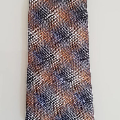 A detailed close-up of the Duchamp Abstract Check Tie’s fabric, showcasing the intricate abstract check pattern in autumnal tones and the fine silk texture woven in Italy.