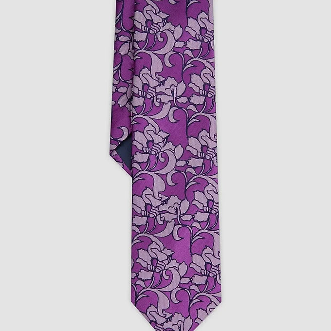 Close-up of the front tip of the Duchamp London Abstract Garden Tie in purple, showcasing the bold abstract garden print and luxurious silk material.